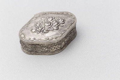 Close-up of coins on white background