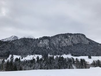 Scenic view of mountains against sky during winter