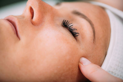 Face lifting massage, beautiful woman getting face lifting massage in a beauty salon.