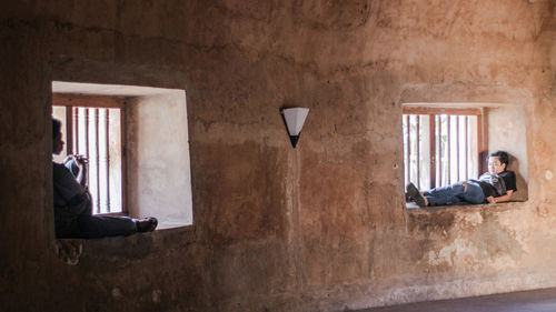 Man sitting by window in building