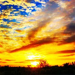 Low angle view of dramatic sky during sunset