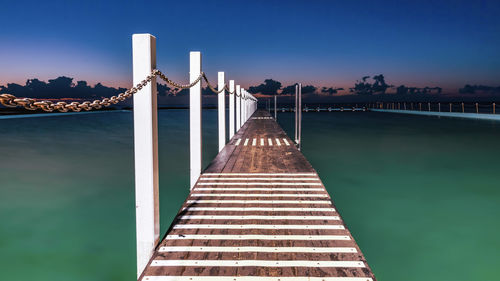 View of bridge over river against blue sky