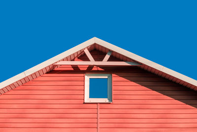 Low angle view of building against clear blue sky