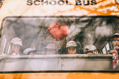 Reflection of people on car window