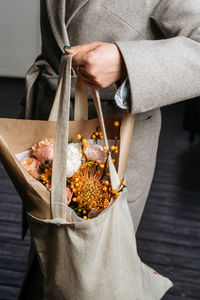 Midsection of woman holding food