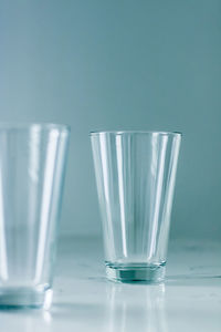 Close-up of drinking glass against white background