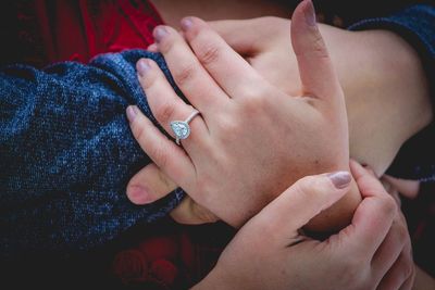 Close-up of couple holding hands