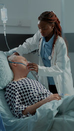 Doctor treating patient at hospital