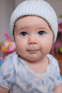 Close-up of cute baby boy at home