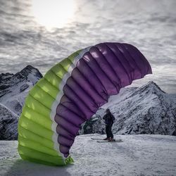 Person walking on snow covered mountain