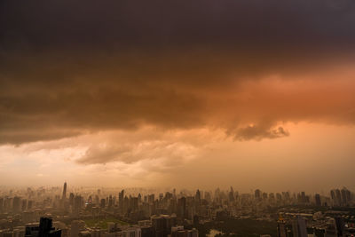 Cityscape against sky during sunset