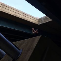 Woman standing by railing