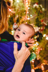 Portrait of woman with christmas tree