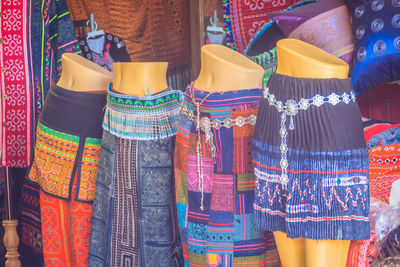 Clothes hanging in store for sale at market stall