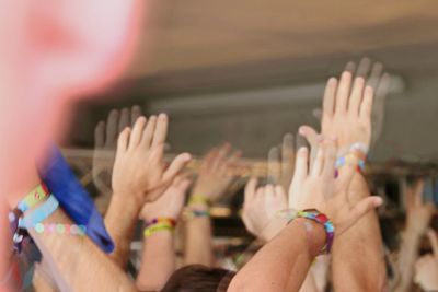 Group of people in front of hands