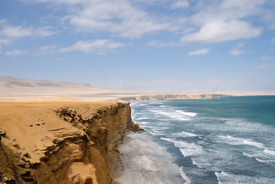 Scenic view of beach against sky