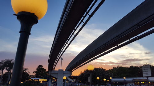 Low angle view of bridge against sky at sunset