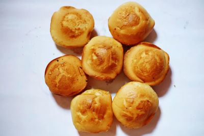 High angle view of bread on white table