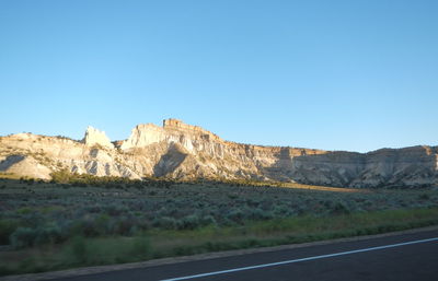 Scenic view of mountains against clear blue sky