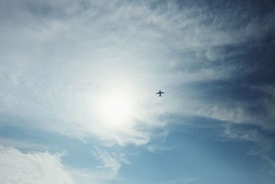 Low angle view of airplane flying in sky