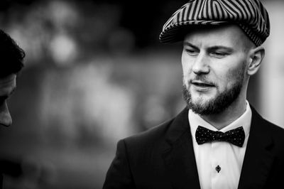 Close-up of well dressed man wearing flat cap