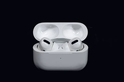 Close-up of electric lamp over black background