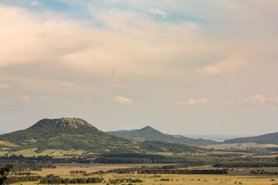 Scenic view of landscape and mountains against sky