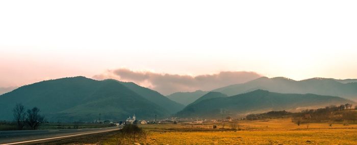 Scenic view of mountains against sky during sunset