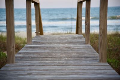 Pier over sea against sky