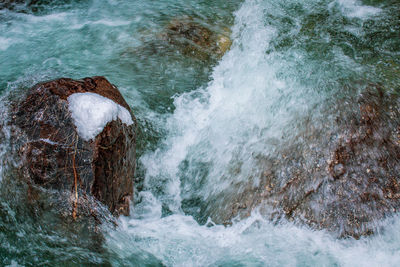 Sea waves splashing on rocks