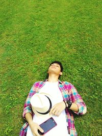 Man relaxing on grassy field