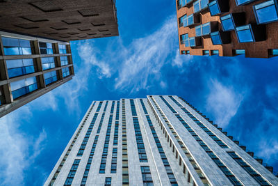 Low angle view of modern buildings against sky