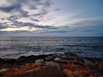 Scenic view of sea against sky during sunset