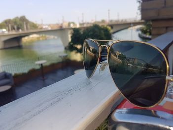 Close-up of sunglasses on car