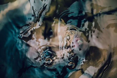 Close-up of young woman in water