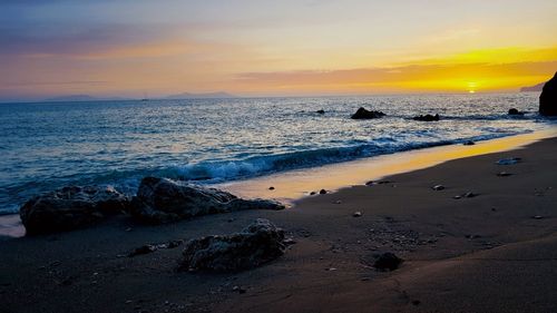 Scenic view of sea against sky during sunset