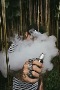 Close-up of young woman holding crab