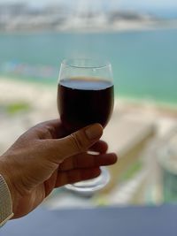 Close-up of hand holding drink