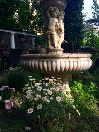 Statue of woman in park