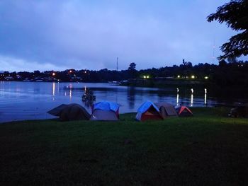 Tent in park against sky at night