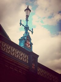 Low angle view of building against cloudy sky