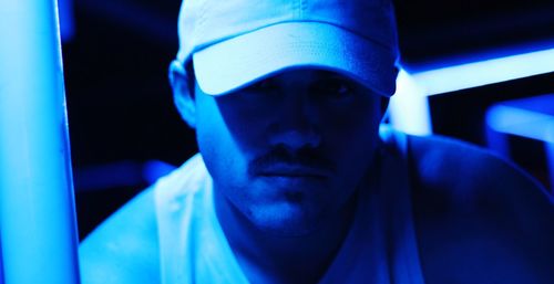 Close-up portrait of man wearing mask