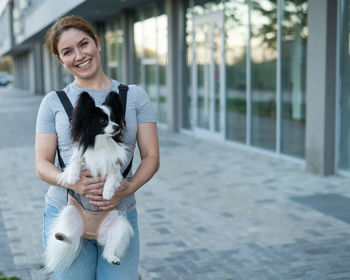 Portrait of woman with dog