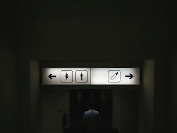 Man on illuminated door