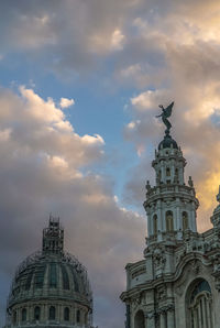 Low angle view of statue of building against sky