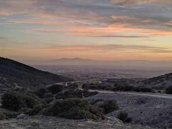 Scenic view of landscape against sky during sunset