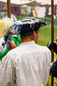 Rear view of man wearing costume during event