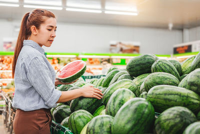 Full length of woman standing at market