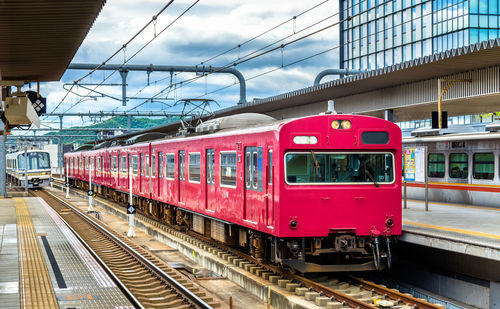 Train on railroad station platform against sky