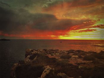 Scenic view of sea against cloudy sky